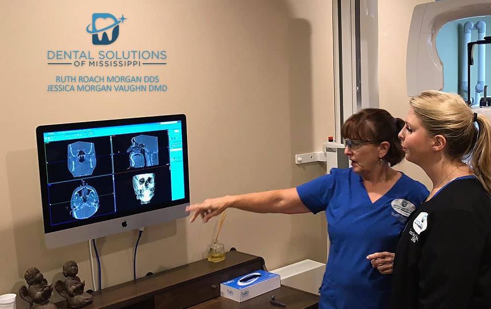 Dental solutions of mississippi Dentists discussing patients xray Dental Solutions of Mississippi dentist in Canton MS Dr. Ruth Roach Morgan Dr. Jessica Morgan