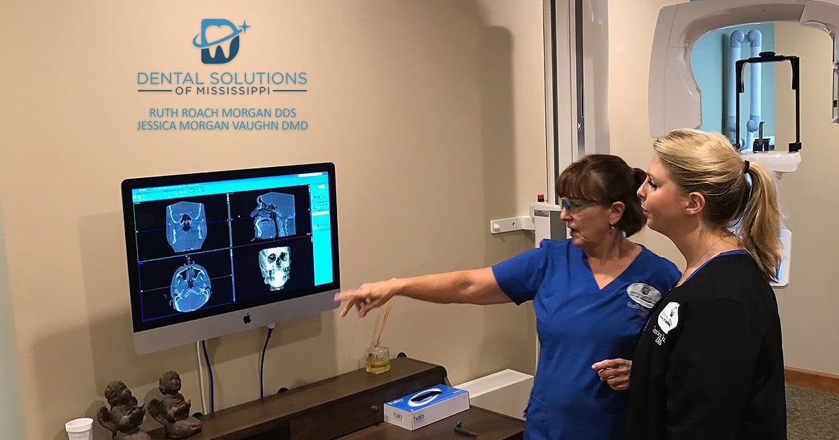 Dental solutions of mississippi Dentists discussing patients xray Dental Solutions of Mississippi dentist in Canton MS Dr. Ruth Roach Morgan Dr. Jessica Morgan