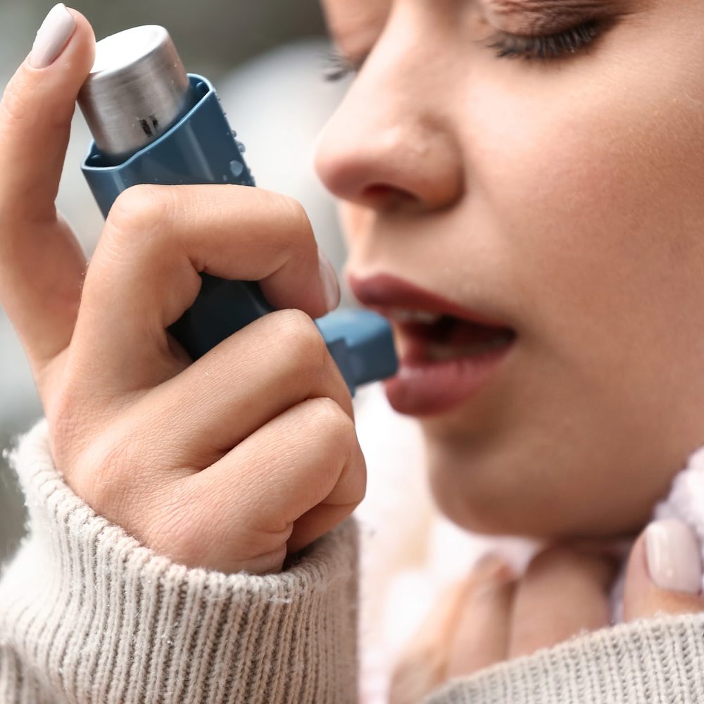 Oral Health The Impact Having Asthma Has On Your Dental Health Woman using asthma inhaler Dental Solutions of Mississippi dentist in Canton MS Dr. Ruth Roach Morgan Dr. Jessica Morgan