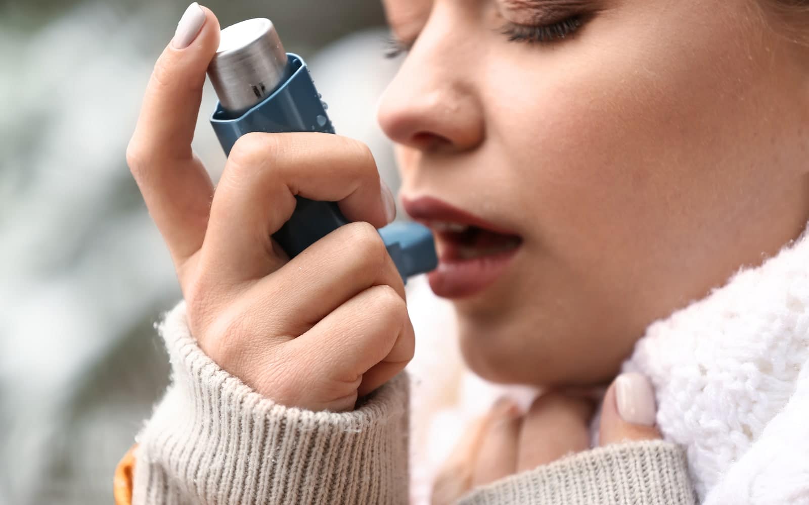 Oral Health The Impact Having Asthma Has On Your Dental Health Woman using asthma inhaler Dental Solutions of Mississippi dentist in Canton MS Dr. Ruth Roach Morgan Dr. Jessica Morgan