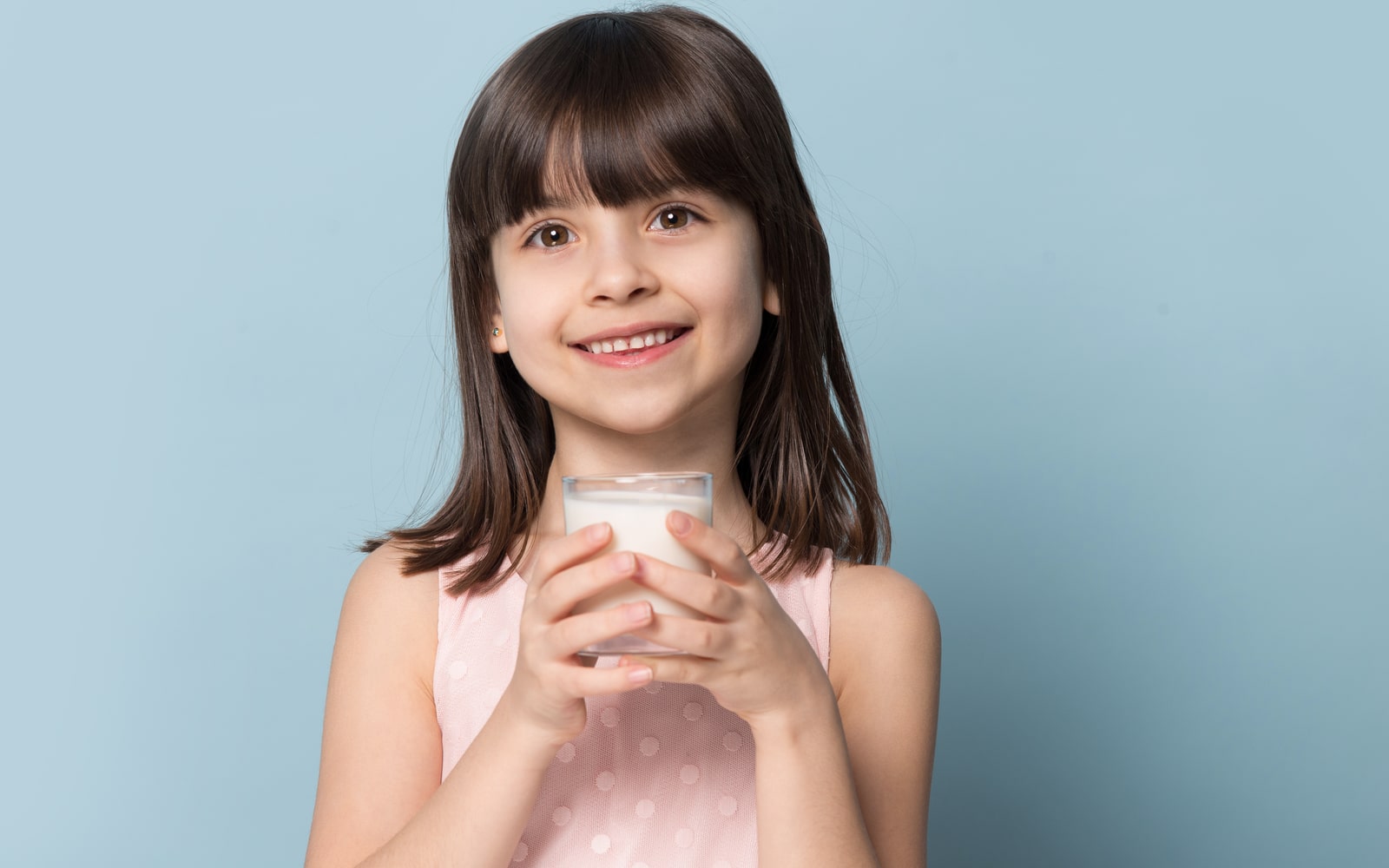 periodontal disease The Fascinating Way Vitamin D Protects Your Gums Smiling child holding glass of milk Dental Solutions of Mississippi dentist in Canton MS Dr. Ruth Roach Morgan Dr. Jessica Morgan